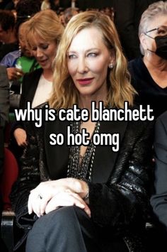 a woman sitting next to a man in a crowd with the caption why is cate blanchett so hot omg?