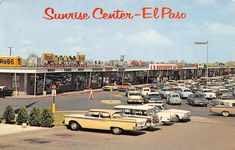 an old photo of cars parked in front of a sunflower center - el paso store