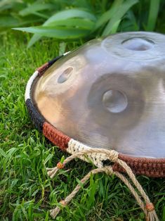 a large metal object sitting in the grass