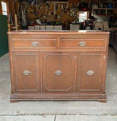 an old wooden cabinet in a garage