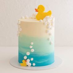 there is a cake with a rubber duck in the water on it's side