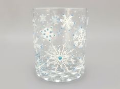 a clear glass with snowflakes on it