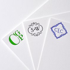 four business cards with the letter g and c in different colors on top of each other