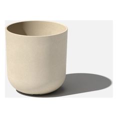 a white cup sitting on top of a table