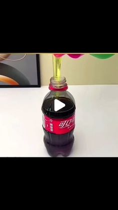 a bottle of soda sitting on top of a table