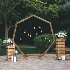 an outdoor ceremony setup with candles and flowers