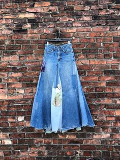 INCREDIBLE patchwork denim skirt from the 1970s made with orange tab LEVIS denim jeans.  Label: LEVIS Measurements: waist: 28" maybe 28.5" hips: 38" length: 42" approx (uneven hem) Condition: some loose patches, a few tears, wear to hem etc as clearly seen. being sold AS FOUND. *ALL SALES CONSIDERED FINAL -vintage is sold in "as-is" / "as-found" condition. we try to mention as best as possible any flaws noted but most of what we sell in this shop is workwear and worn in clothing that shows flaws Jeans Into Skirt, Refashion Jeans, Creating Clothes, Jeans Label, Patchwork Denim Skirt, Long Jean Skirt, Moda Denim, Clothes Life Hacks, Upcycle Clothes Diy