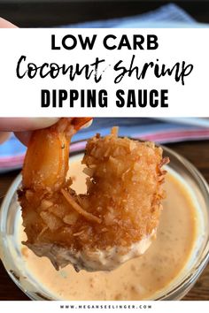 a person dipping some food in a bowl with the words keto coconut shrimp with dipping sauce