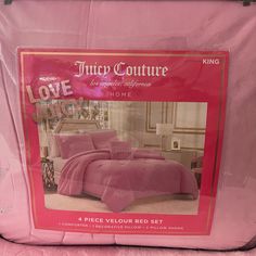 the pink bedding is on display in front of an advertisement for love couture