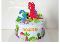 a birthday cake decorated with dinosaurs and numbers