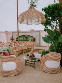 the inside of a tent with tables and chairs