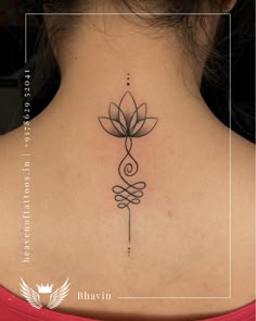 a woman with a tattoo on her back neck