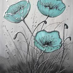 three blue flowers with water droplets on the glass wall behind them and grass in the foreground