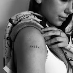 a woman with a tattoo on her arm