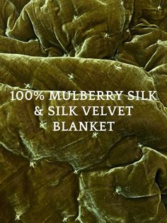 a pile of blankets with the words 100 % mulberry silk and silk velvet blanket