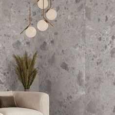 a modern living room with grey marble walls