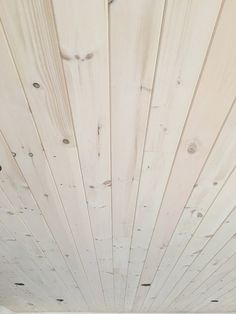 the ceiling is painted white and has wood planks