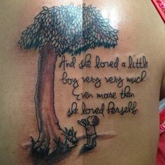 a woman's back with a tree tattoo on her shoulder and the words, and she loved a little boy very very much