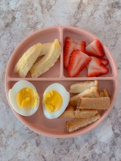 a pink plate topped with eggs, toast and fruit