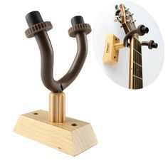 a wooden stand with a violin on it's back and an image of the neck