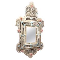 an ornate mirror is hanging on the wall