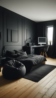 a bedroom with black walls and wooden flooring has a bed, desk, chair, television and window