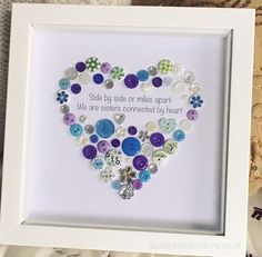 a white frame with buttons in the shape of a heart