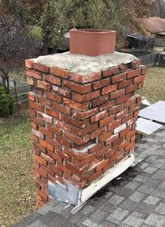 a brick chimney on the side of a house