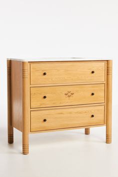 a wooden dresser with two drawers and one drawer