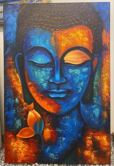 a painting of a buddha face with a flower in its hand and the image is painted on canvas