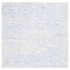 a blue and white rug with an abstract design