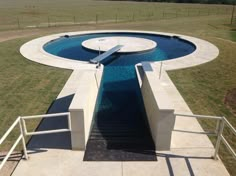 an aerial view of a pool with stairs leading up to it