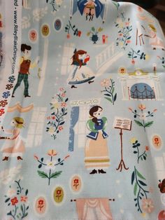 the fabric is very colorful and has many different designs on it, including princesses