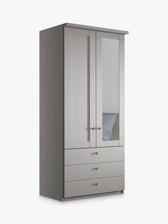 a white armoire with mirrored doors and drawers