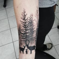 a person with a deer tattoo on their arm and the words love this nature tattoo by jan miller