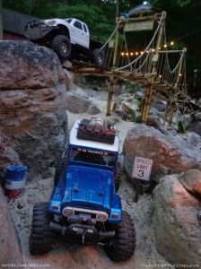 there is a blue truck that is parked in the rocks