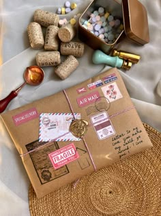 an open mail box sitting on top of a table next to some candy and other items