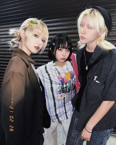 three young women standing next to each other