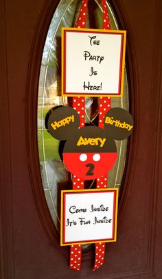 a mickey mouse birthday door hanger on the front door