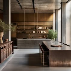 a large kitchen with wooden cabinets and counter tops