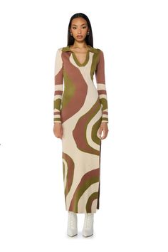 Make waves in The AKIRA Label Adeline Collared Knit Maxi Dress! Crafted from a thick and stretchy knit base fabrication, this cozy piece features a wavy abstract print, a deep V neckline, a pointed collar, long sleeves, a hip-hugging silhouette, and a maxi length with a side slit hem for easy mobility. Complete with an easy pull-on fit. Pair with stiletto booties and a woven shoulder bag to finish off your look.  - 50% Viscose 30% Polyester 20% Nylon  - Hand or Machine Wash Cold - Super Stretchy - Imported (all measurements are approximate from size small) - 60” Shoulder to Hem - 24.5” Sleeves - 16.5” Shoulder to Shoulder - Model is 5’10” Product ID: 387967 Hugging Silhouette, Knit Maxi Dress, Make Waves, Maxi Knit Dress, Abstract Print, Deep V, Long Sleeves, Maxi Dress, Shoulder Bag