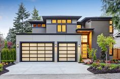 a modern style house with two garage doors