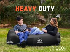 two people sitting on an inflatable bean bag chair with the text heavy duty