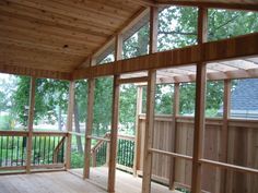 the inside of a house that is being built with wooden framing and wood flooring