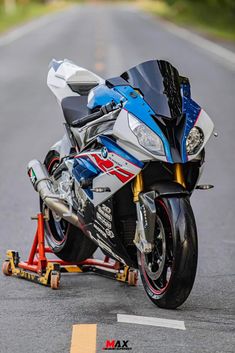 a blue and silver motorcycle on the road