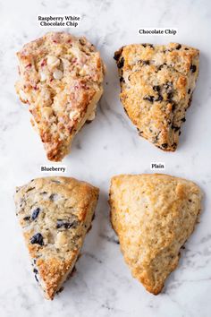 four different types of scones on a marble counter top with the names below them