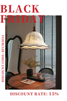 a table with a lamp on it and the words black friday in red above it