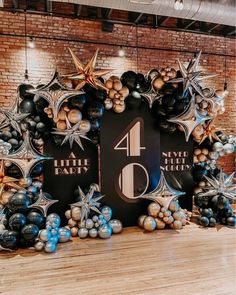 an image of a table with balloons and decorations on it for a birthday party or celebration