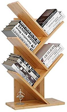 a wooden book stand holding several books and figurines on top of each other