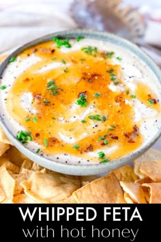 a bowl of whipped feta with tortilla chips on the side and text overlay